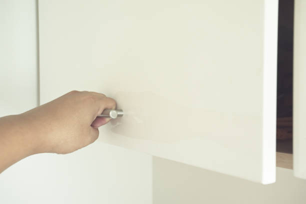 istock Man hand open the wood box or cabinet door 1048783882