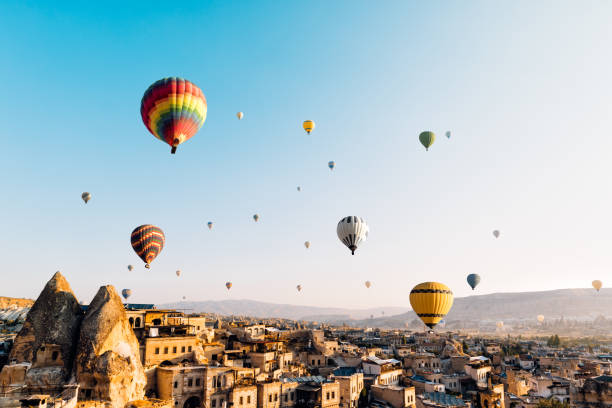 Hot air balloons over Cappadocia at sunrise，Turkey Flying, Hot Air Balloon, Cappadocia, Göreme, Turkey - Middle East türkiye country stock pictures, royalty-free photos & images