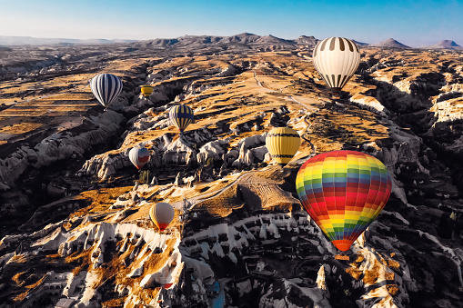 istock Aerial view of hot air balloons flying over Cappadocia at sunrise，Turkey 1048784834