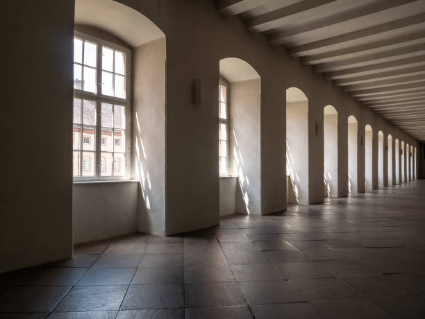 A historic empty building, sunlight coming in through the window