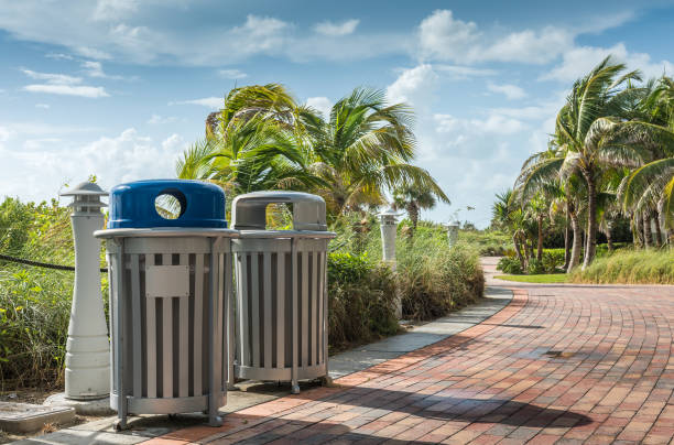Recycling bins beside a footpath in Miami Beach.