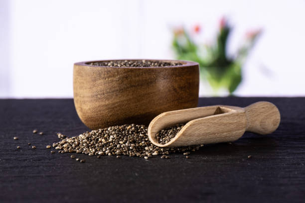 istock Fresh mottled chia seeds on white with flowers 1048794624