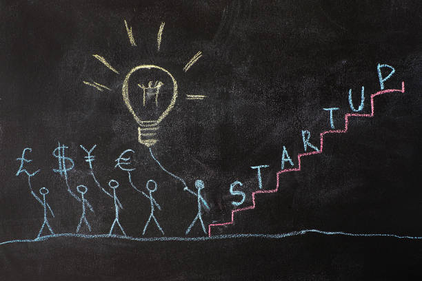 istock Group of people drawing on a school chalkboard. 1048797190