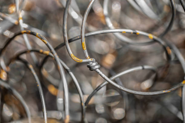 istock Steel spring. Iron wire with traces of rust. 1048800182