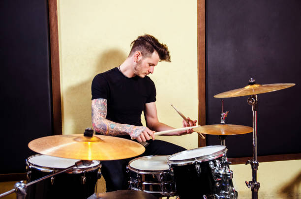 istock Tattooed drummer on rehearsal 1048800224