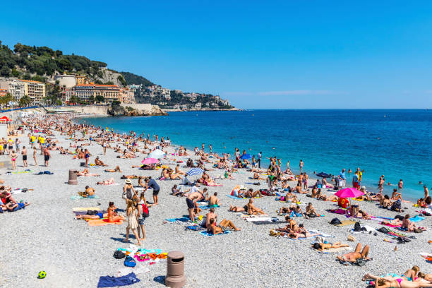 municipal beach near promenade des anglais in city of nice, french riviera, france - city of nice france french riviera promenade des anglais imagens e fotografias de stock