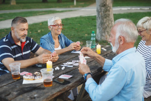 istock Senior people playing cards game 1048807540