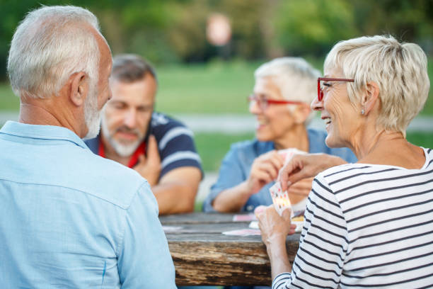istock Senior people playing cards game 1048810440