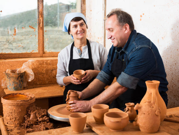 istock Couple among the pottery 1048814452
