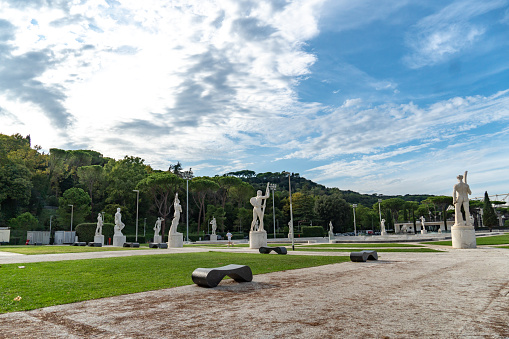 Rome, Italy - September 4, 2018: Marble statues of athletes in the Stadio dei Marmi. The Stadium of the Marbles is a sport stadium in the Foro Italico, formerly Foro Mussolini, a sport complex in Rome