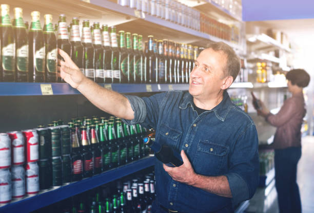 istock Pensioner selecting a beer at the  store 1048815530