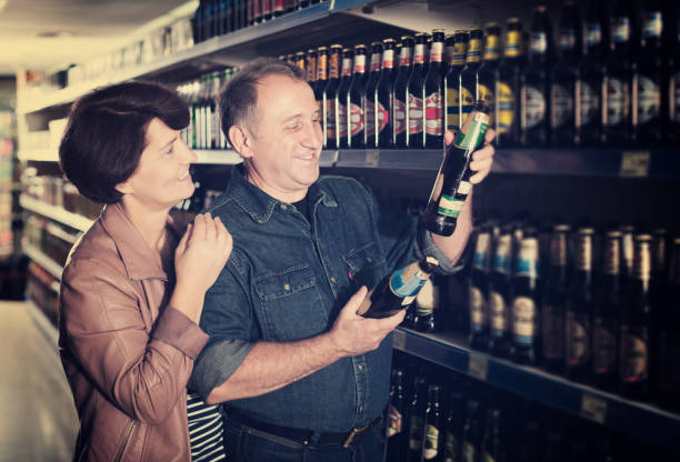 istock Couple shooses beer in store 1048815554