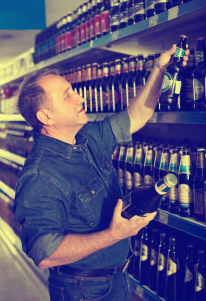 istock European selecting a beer at the grocery store 1048816120