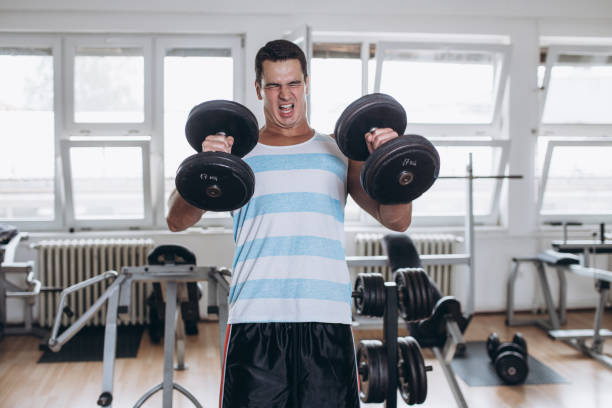 istock Attractive young man in gym 1048817688