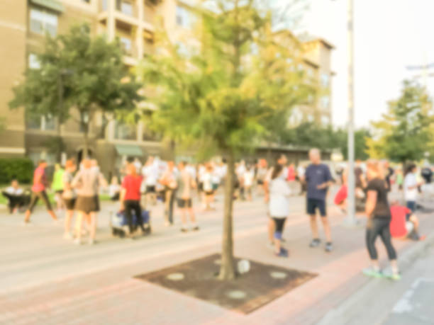 istock Blurry background multiethnic participants crowd at 5K running event in Texas, USA 1048818080