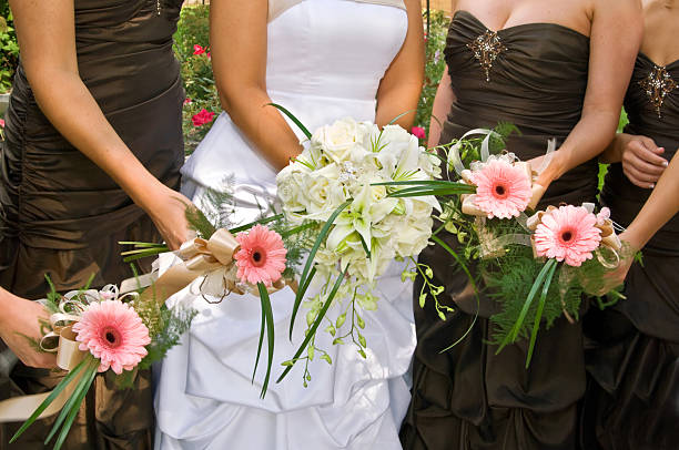 istock Bride with Bridesmaids holding flowers 104882034
