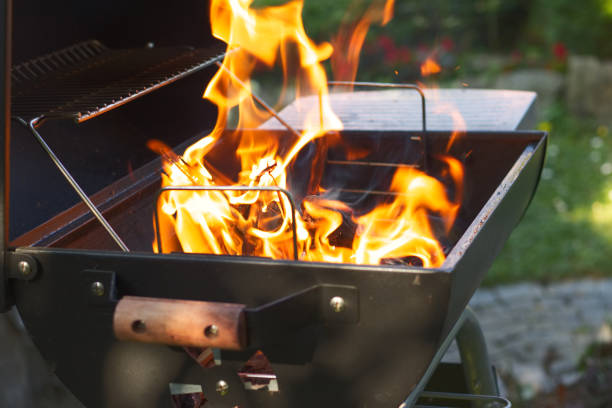 istock Burning fire before grilling. Preparation of grill before barbecue party. 1048821358