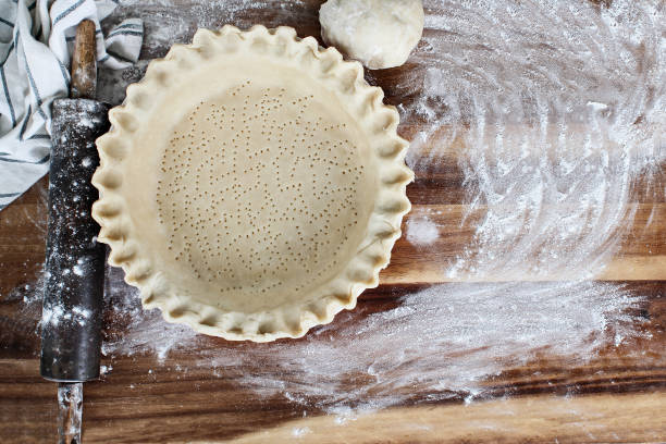 istock Homemade Butter Pie Crust in Pie Plate with Rolling Pin 1048824610