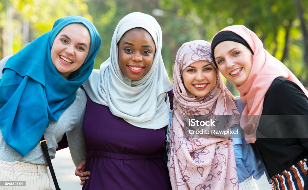Group of islamic friends embracing and smiling together Islam Stock Photo