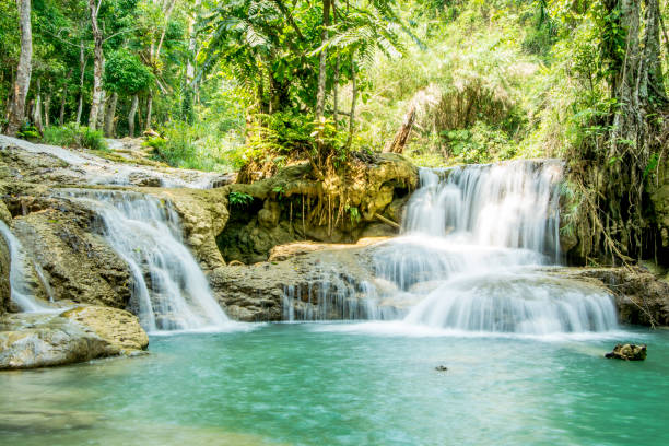 istock Kuang Si Falls waterfall and natural pool 1048825250