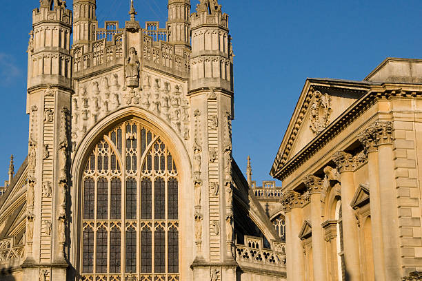 Abbey Churchyard Abbey Churchyard in Bath, Somerset, England. Historic Georgian style buildings built of traditional honey colored sandstone. bath abbey stock pictures, royalty-free photos & images