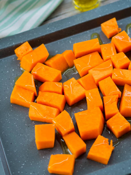 istock Chopped pumpkin drizzled with oil for baking 1048827912