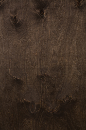 Wood texture on veneer surface dark brown walnut color