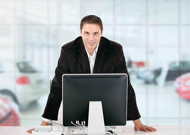 istock Car salesman in his office. 104882851