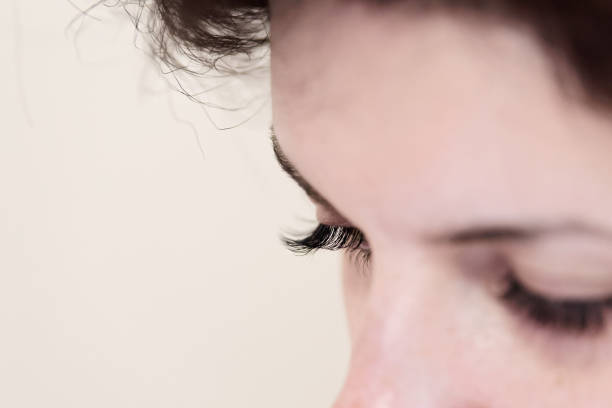istock Closed woman eyes with long eyelashes 1048828660