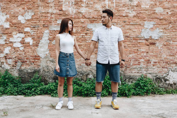 istock Asian couple holding hands together 1048831350