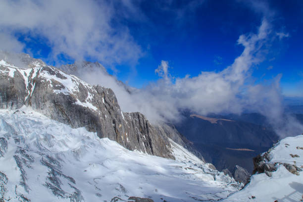 A mountain covered with layers of snow