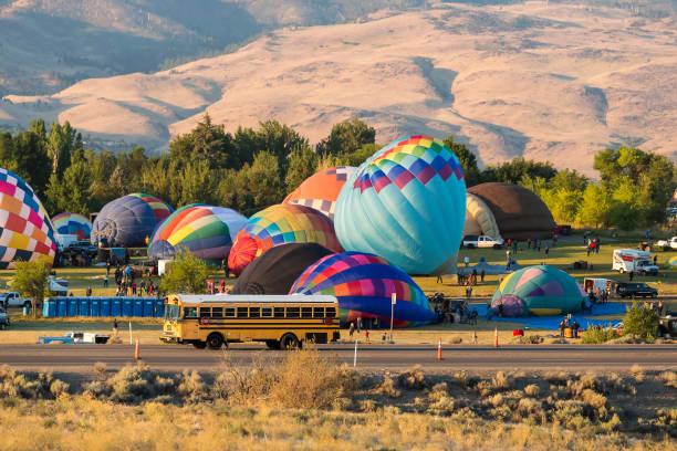 istock Hot air balloons taking off in a beautiful blue clear sky 1048834500