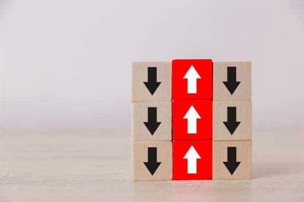 istock Red wooden blocks with white arrows facing opposite to the black arrows. With different concepts to other people. Going for success. 1048835430