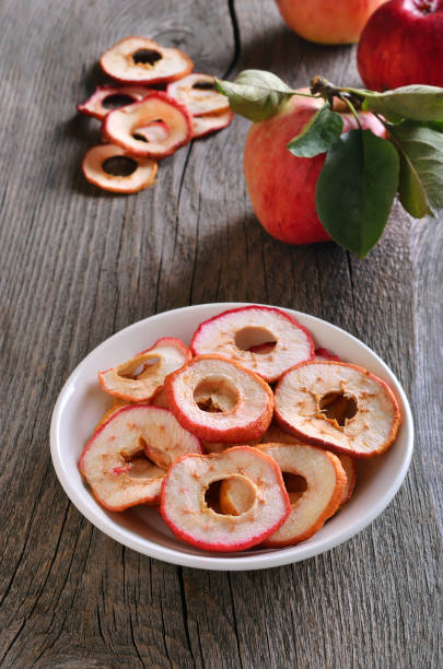 istock Dried apple rings in white bowl 1048835730