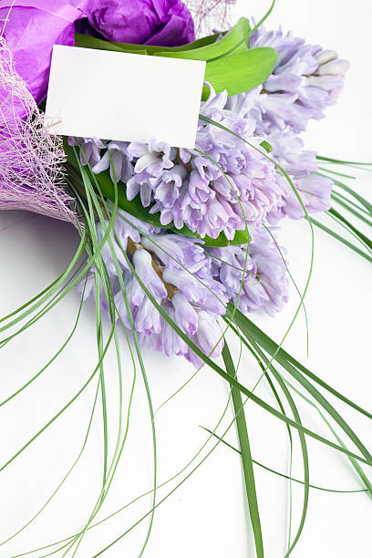 istock Bouquet of flowers with blank white card 104883618