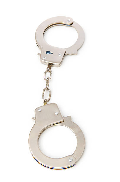 istock Metal handcuffs isolated on the white background 104883958