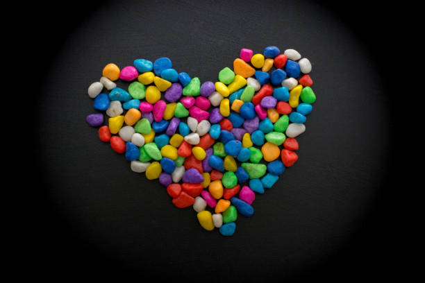 istock Colorful little pebbles form a heart shape 1048842208