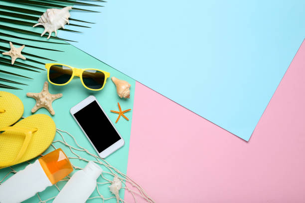 istock Summer accessories with seashells and smartphone on colorful background 1048842924