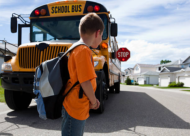 istock Young boy waiting to cross street 104884417