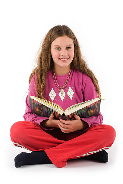 Girl reading a book stock photo