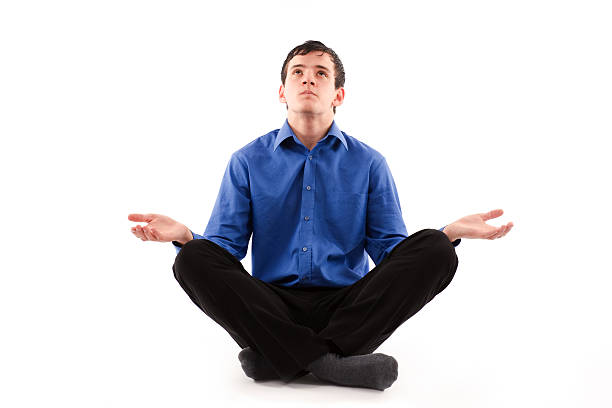 Businessman meditating stock photo