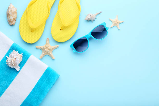 istock Summer accessories with seashells on blue background 1048848856