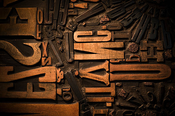 Wooden letters on a dark brown background stock photo