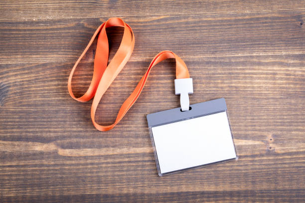 istock White empty staff identity mockup with orange lanyard. Name tag, ID card 1048853564