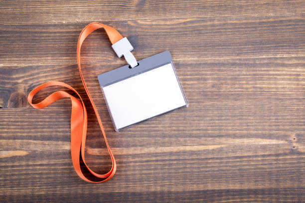 istock White empty staff identity mockup with orange lanyard. Name tag, ID card 1048853572