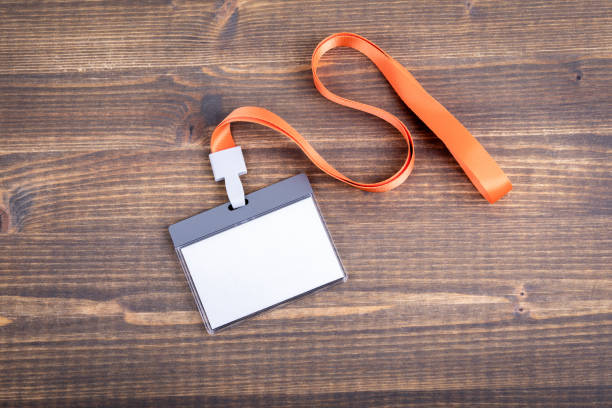 istock White empty staff identity mockup with orange lanyard. Name tag, ID card 1048853588