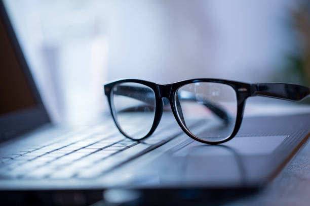 istock Eyeglasses on Laptop Indoors 1048855916