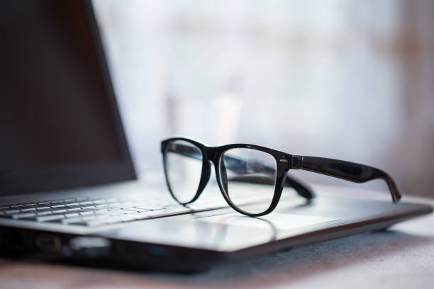 istock Eyeglasses on Laptop Indoors 1048855926