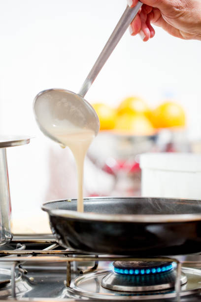 istock Woman Baking Pancakes at Home 1048855946