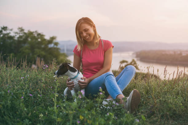 istock Woman with her dog Jack Russell Terrier 1048856096